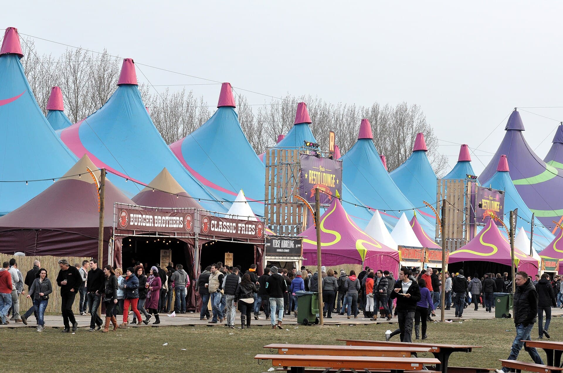 The Apollo mainstage seen from the field with a daytime crowd