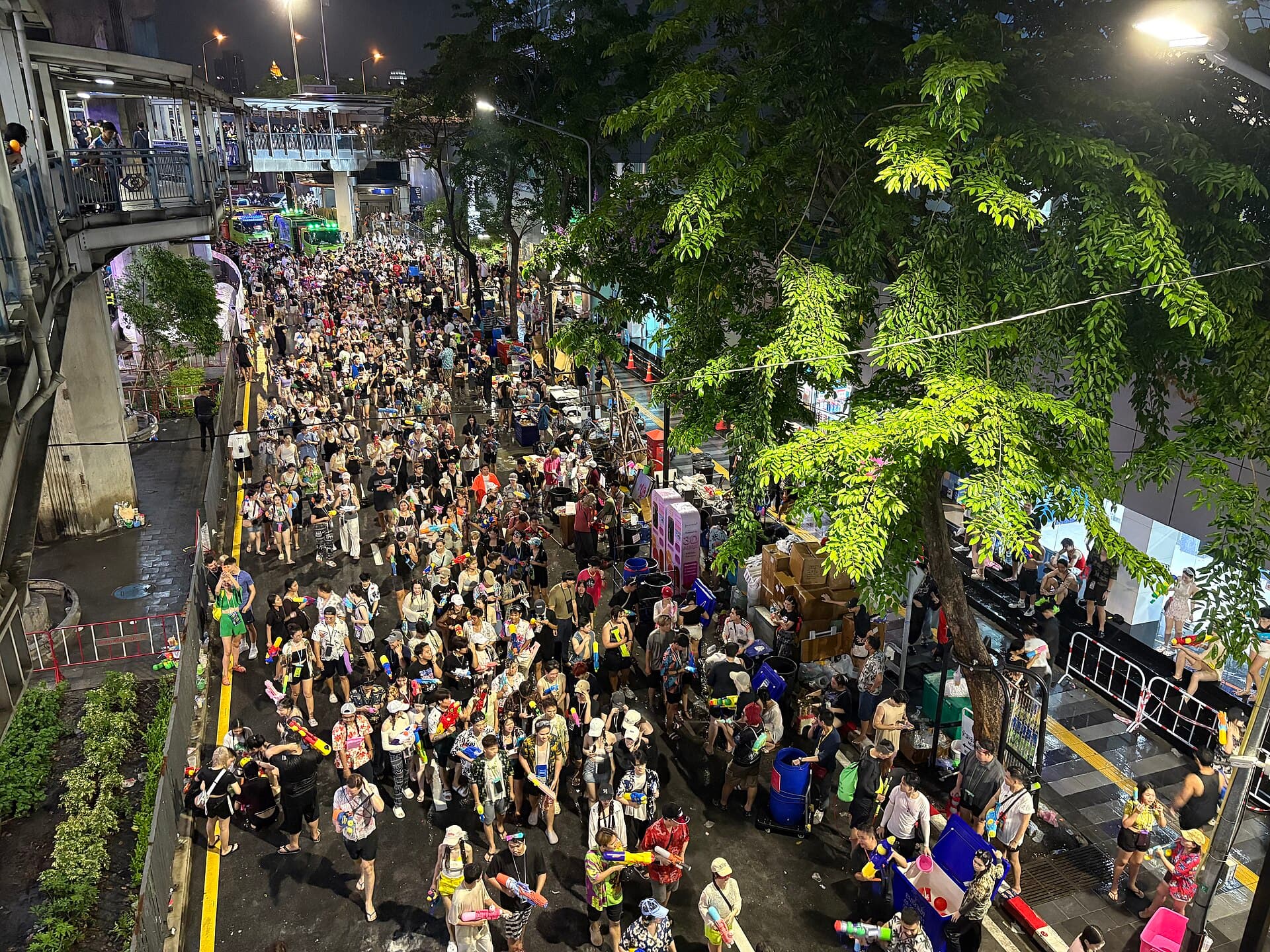 Police officers checking bags at a Songkran entry point on Chakraphong Road near Khao San Road