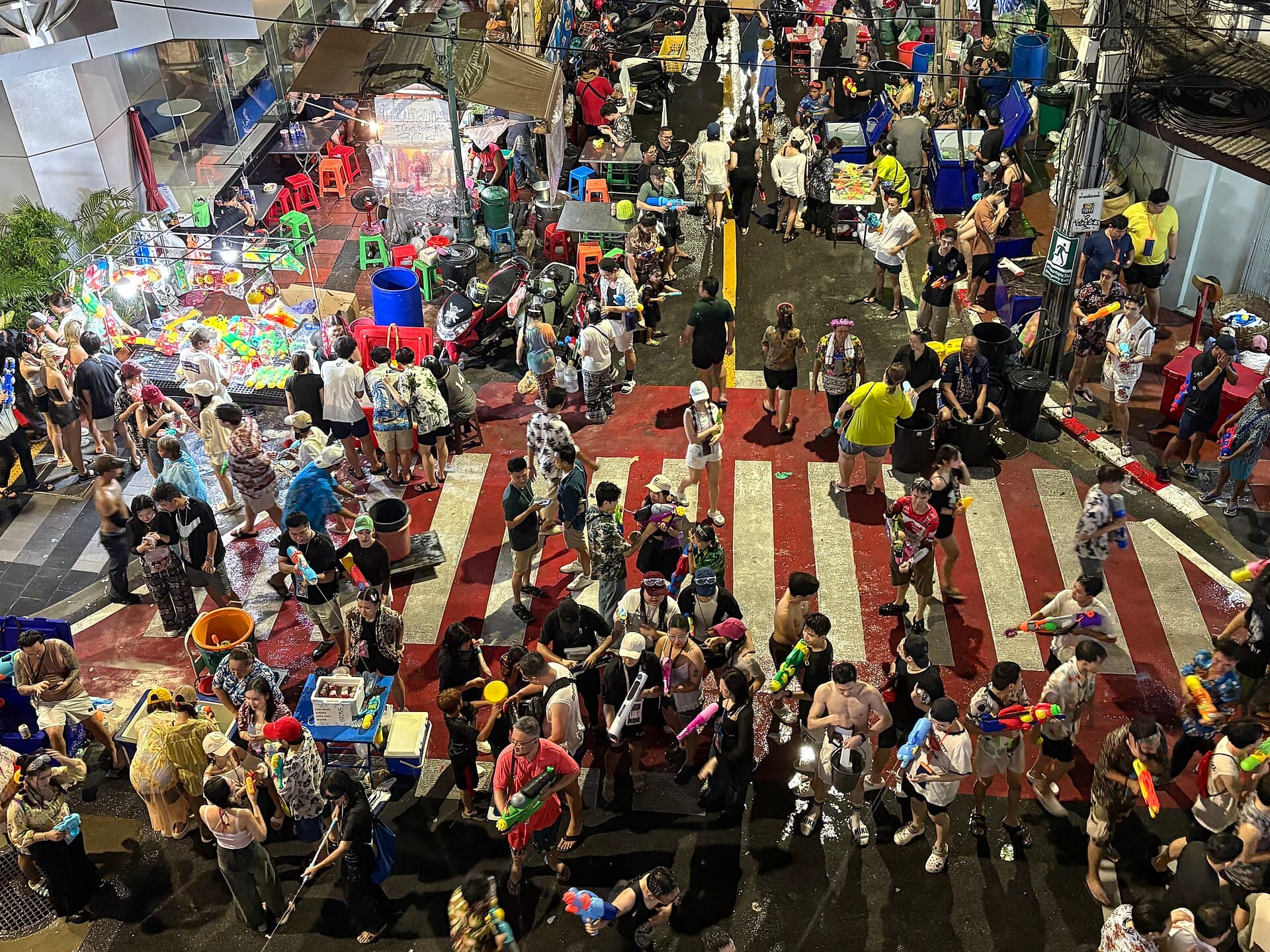 Visitors passing through a security screening gate at the entrance to Silom Road during Songkran