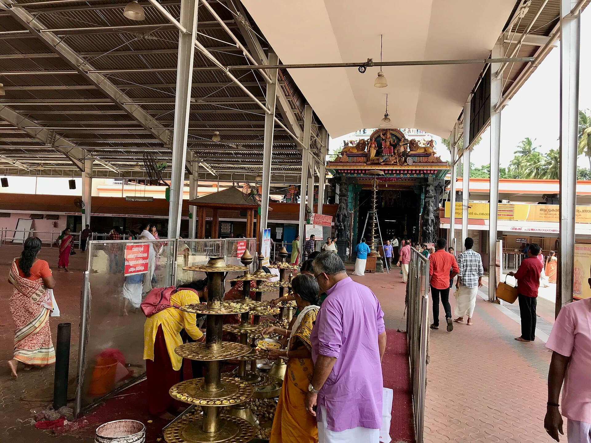 Women tending pots in front of the gopuram of Attukal Bhagavathy Temple on Pongala day