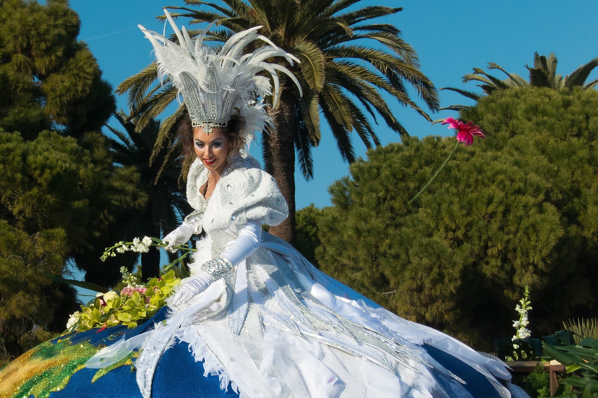 A flower battle on the Promenade des Anglais with performers throwing flowers toward spectators