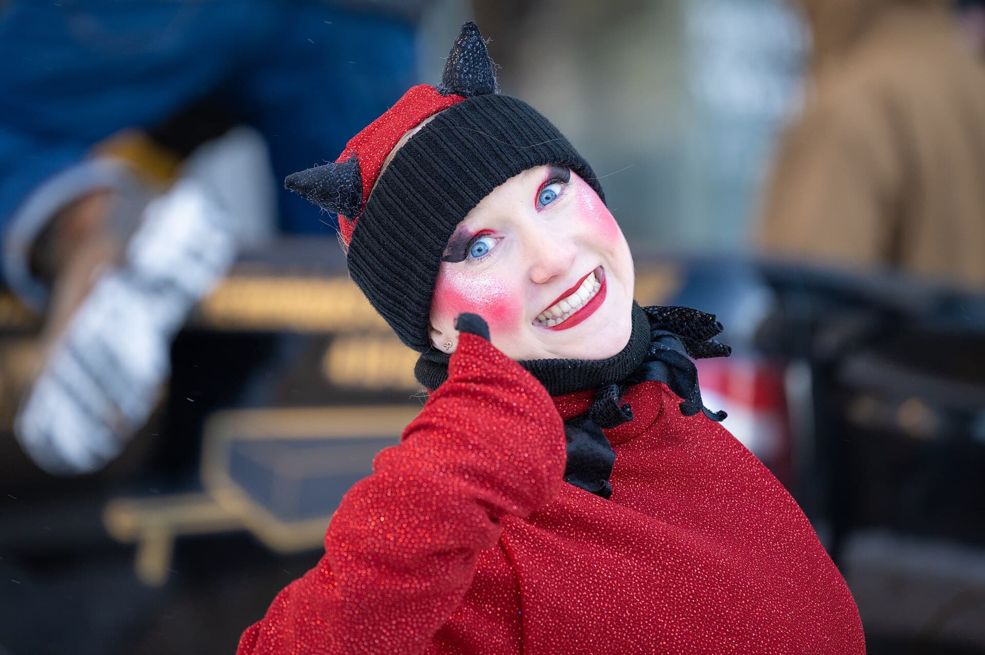 Bonhomme Carnaval in his red tuque and ceinture fléchée greeting visitors