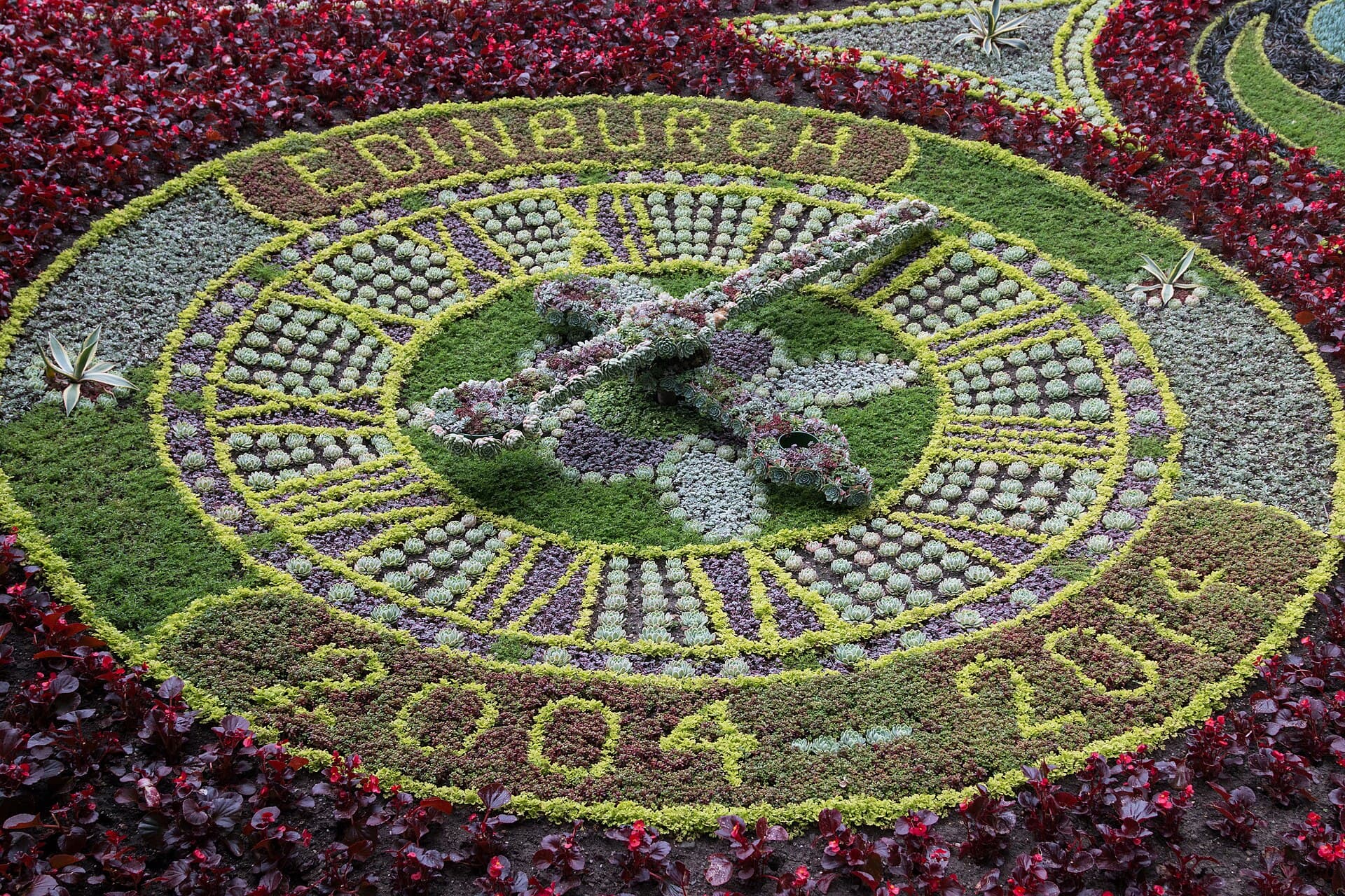 The Floral Clock in West Princes Street Gardens with Edinburgh Castle above
