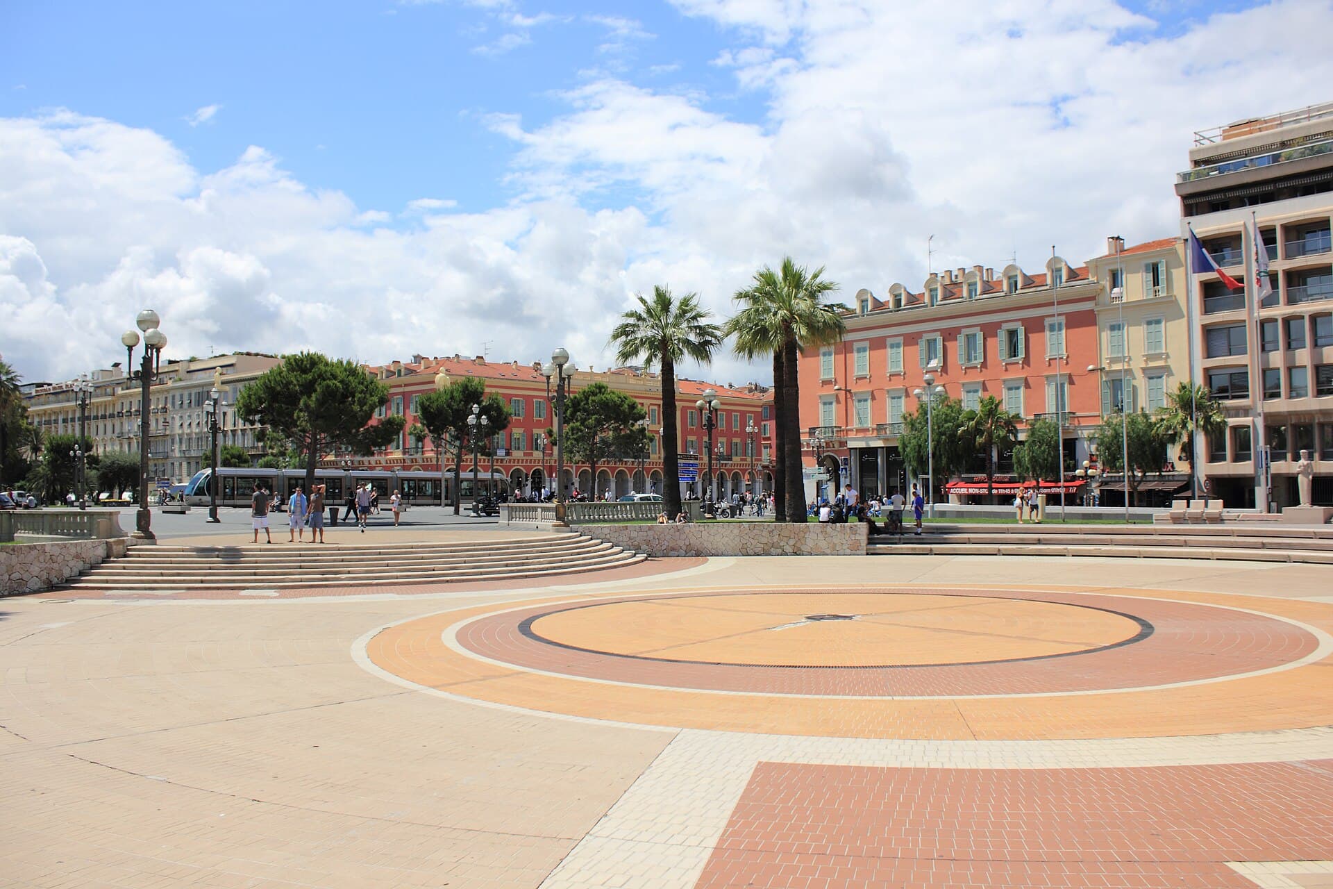 Nice tramway crossing Place Masséna with the red buildings in the background