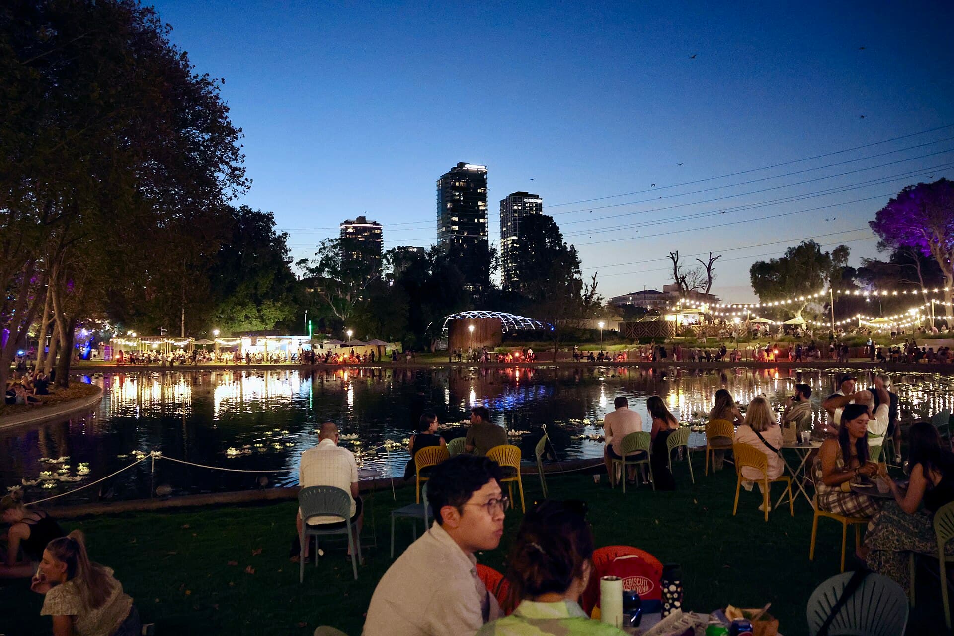 The Gluttony lake in Rymill Park with the Spiegeltent roofs in the background