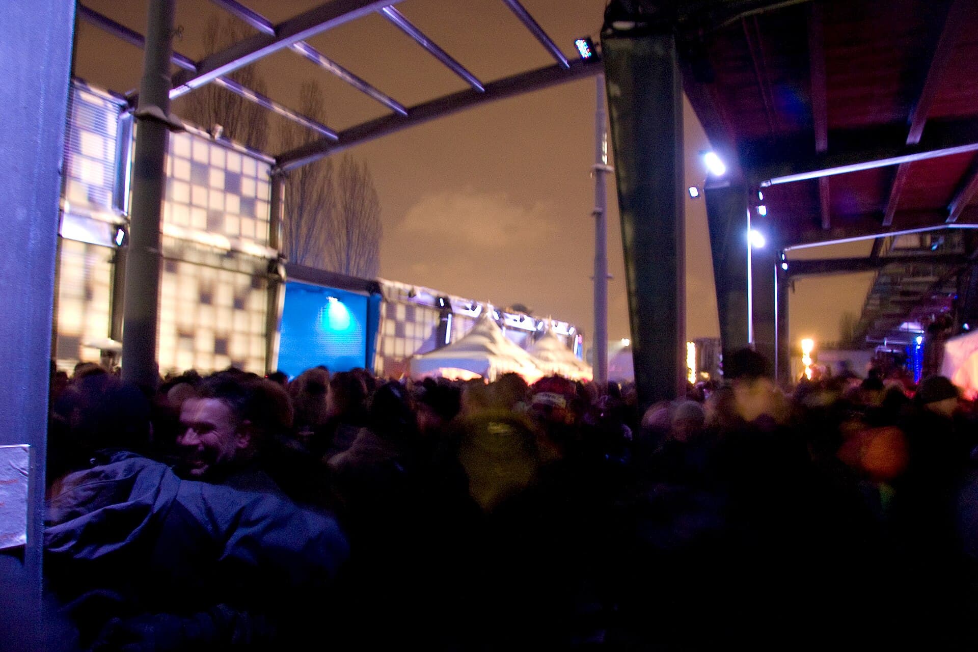 Igloovillage with food trucks and heated areas seen at night on the pier