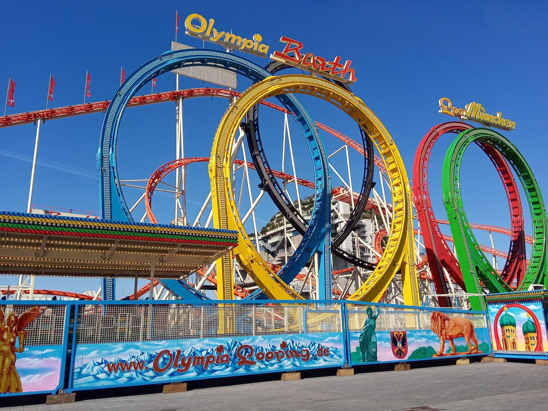The Olympia Looping roller coaster with its five loops against a blue evening sky