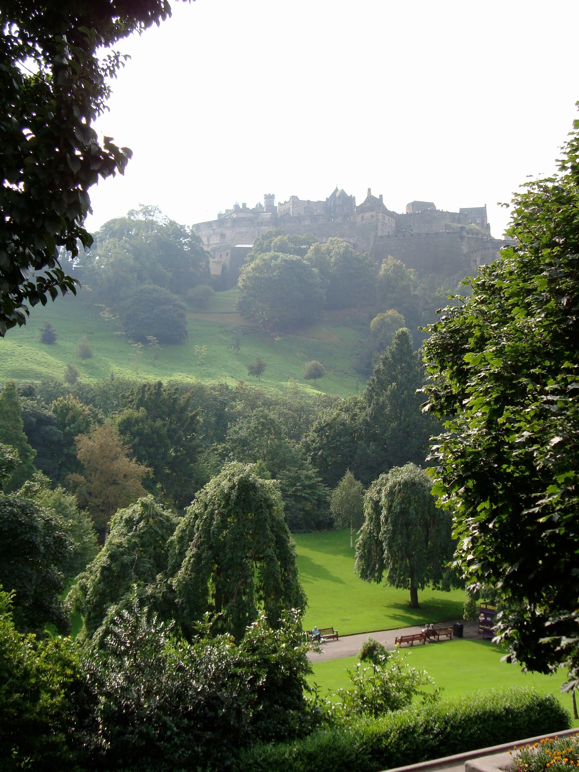 Princes Street Gardens covered in snow with Edinburgh Castle behind