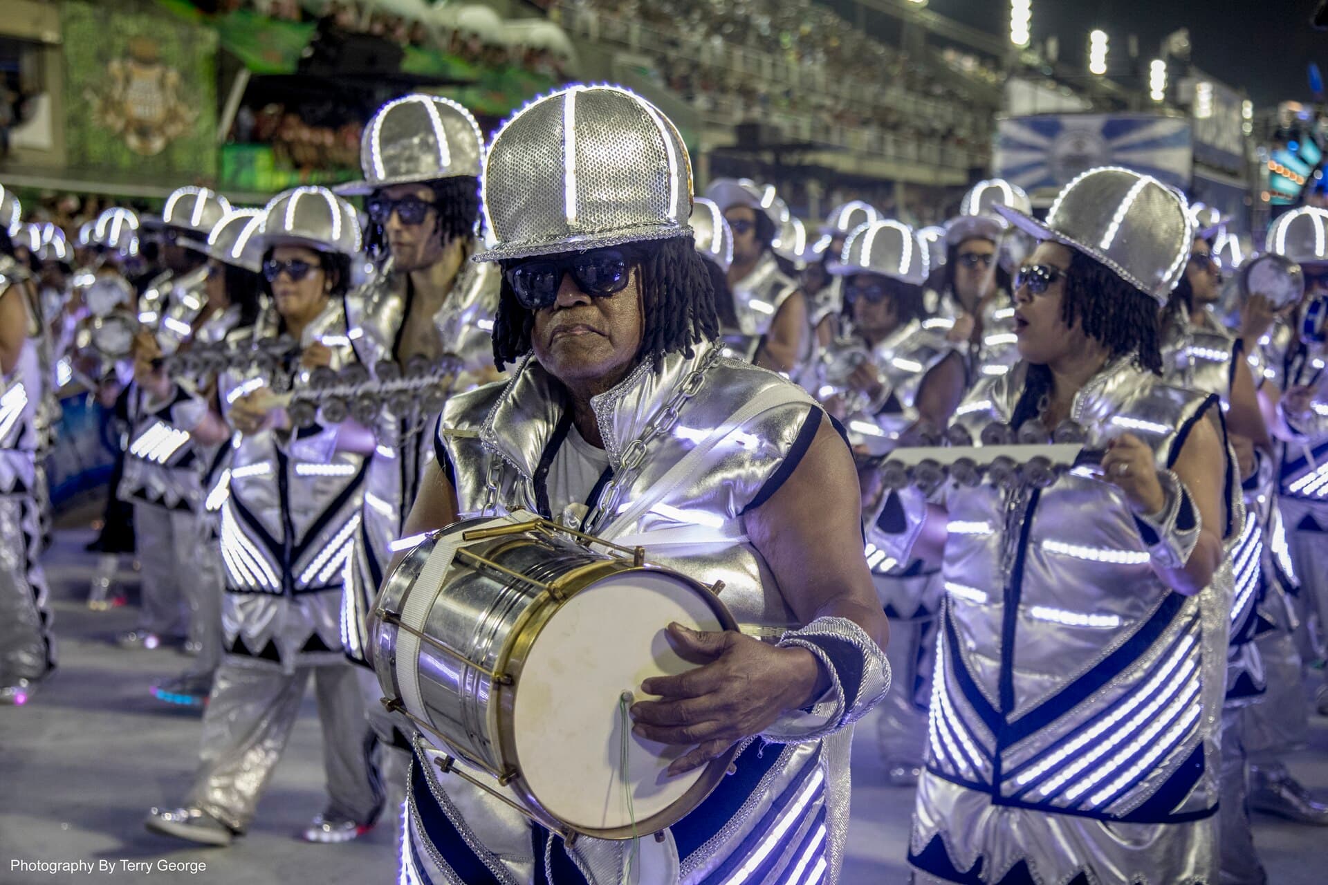 Packed Sambadrome grandstands facing the avenue during a night parade