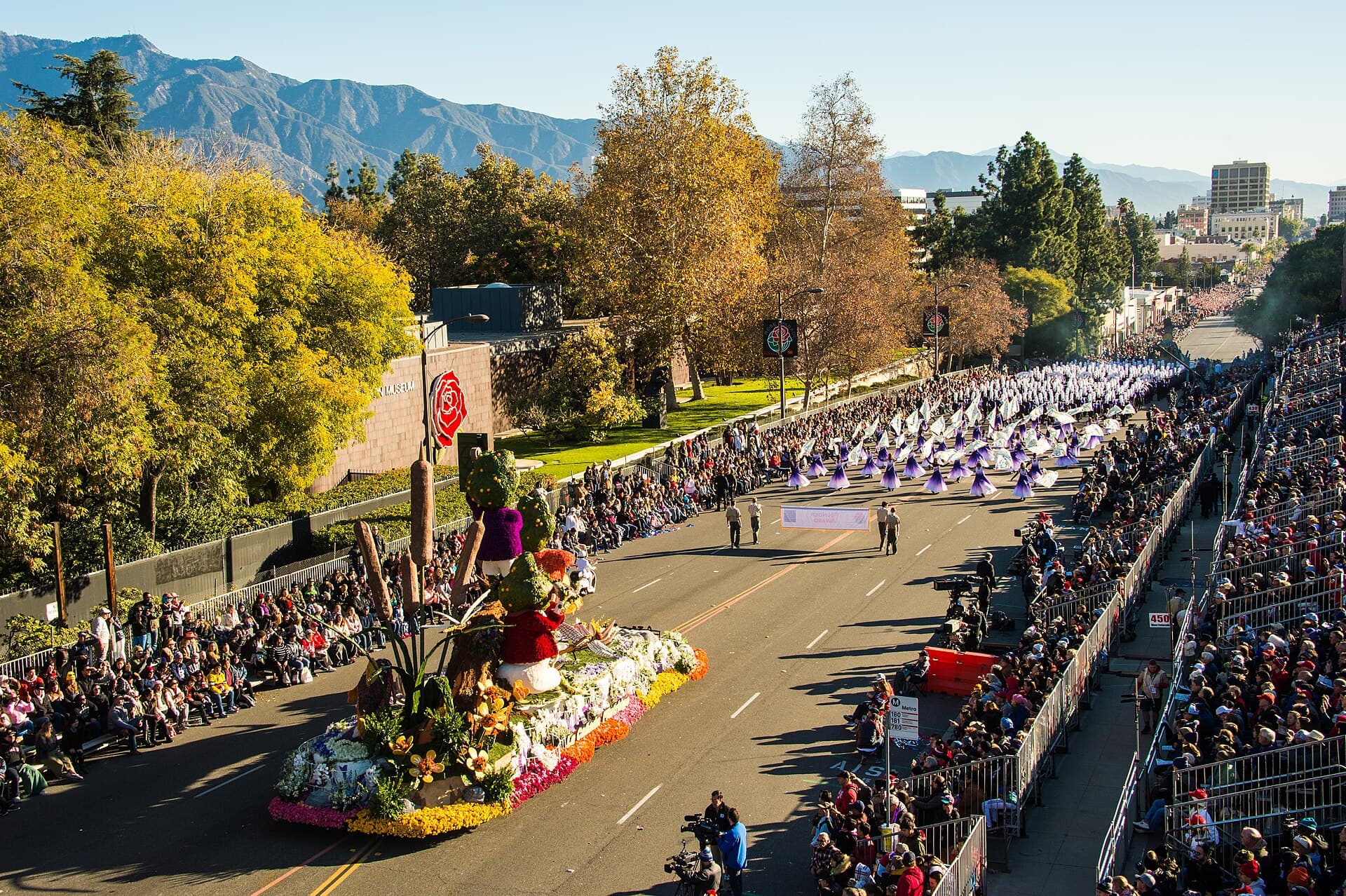 A marching band in uniform on Colorado Boulevard during the Rose Parade in Pasadena