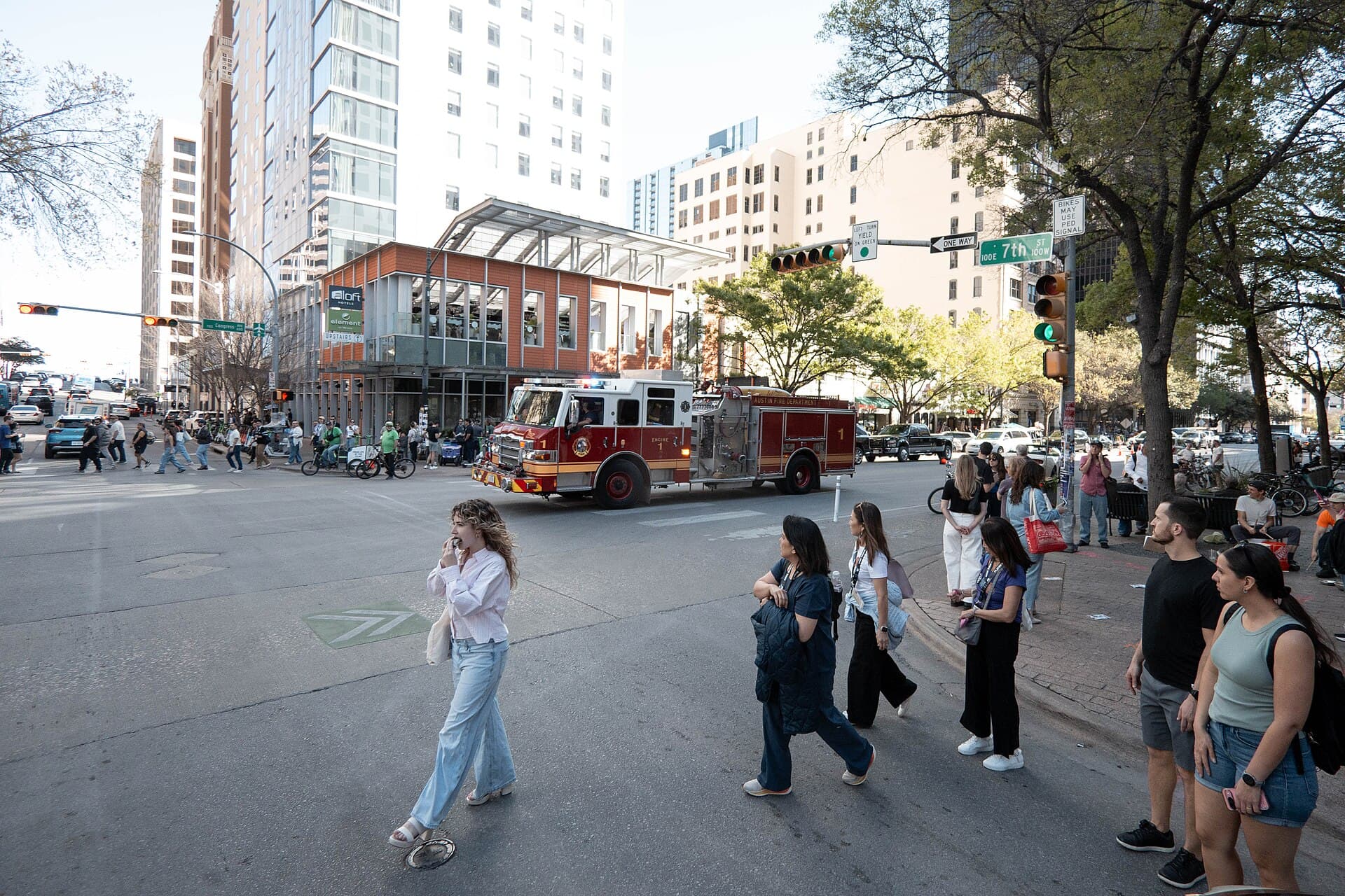 Wide shot of Congress Avenue in downtown Austin during South by Southwest with crowds on the closed street and the Texas State Capitol in the background