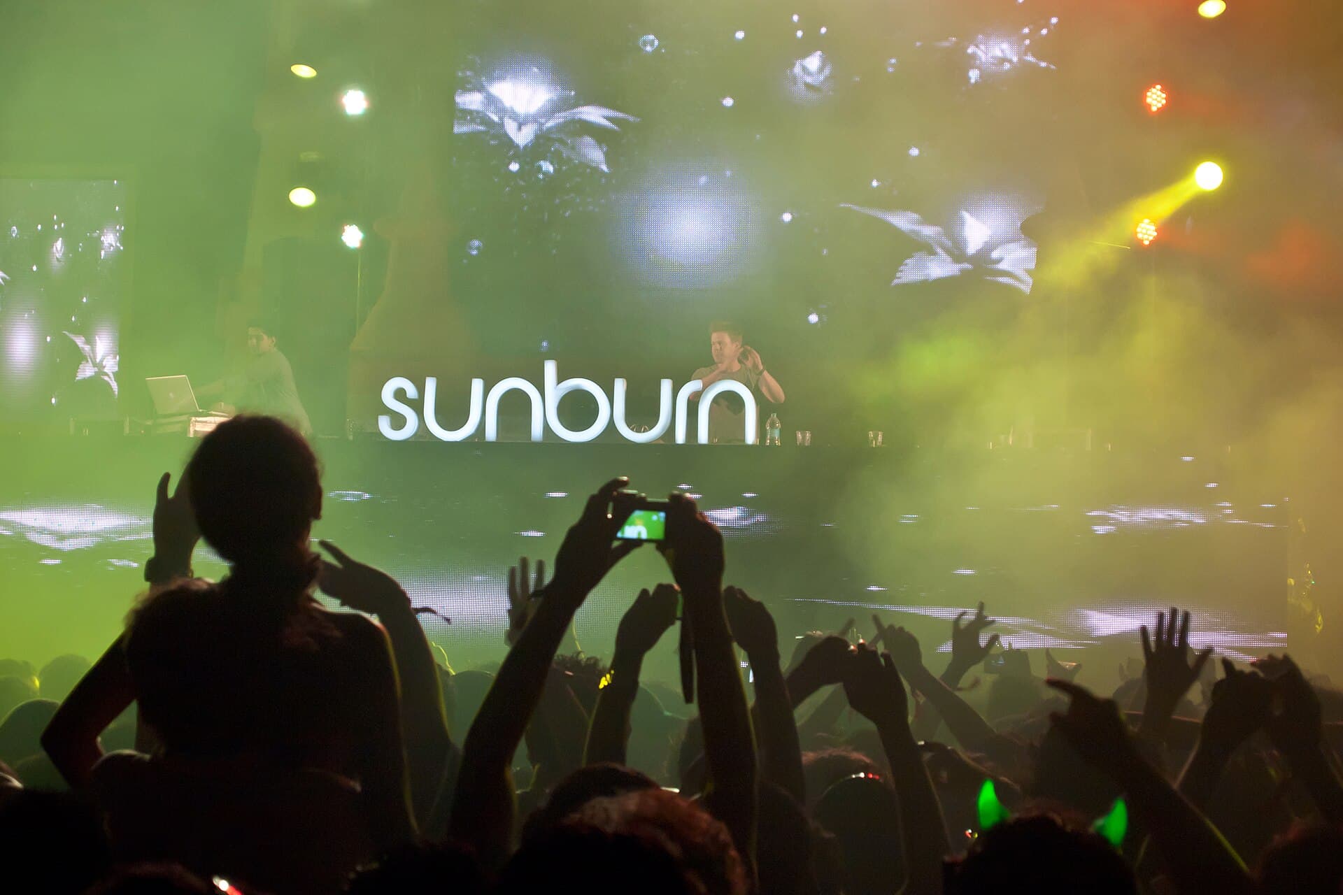 The Chainsmokers performing at a large electronic music festival mainstage