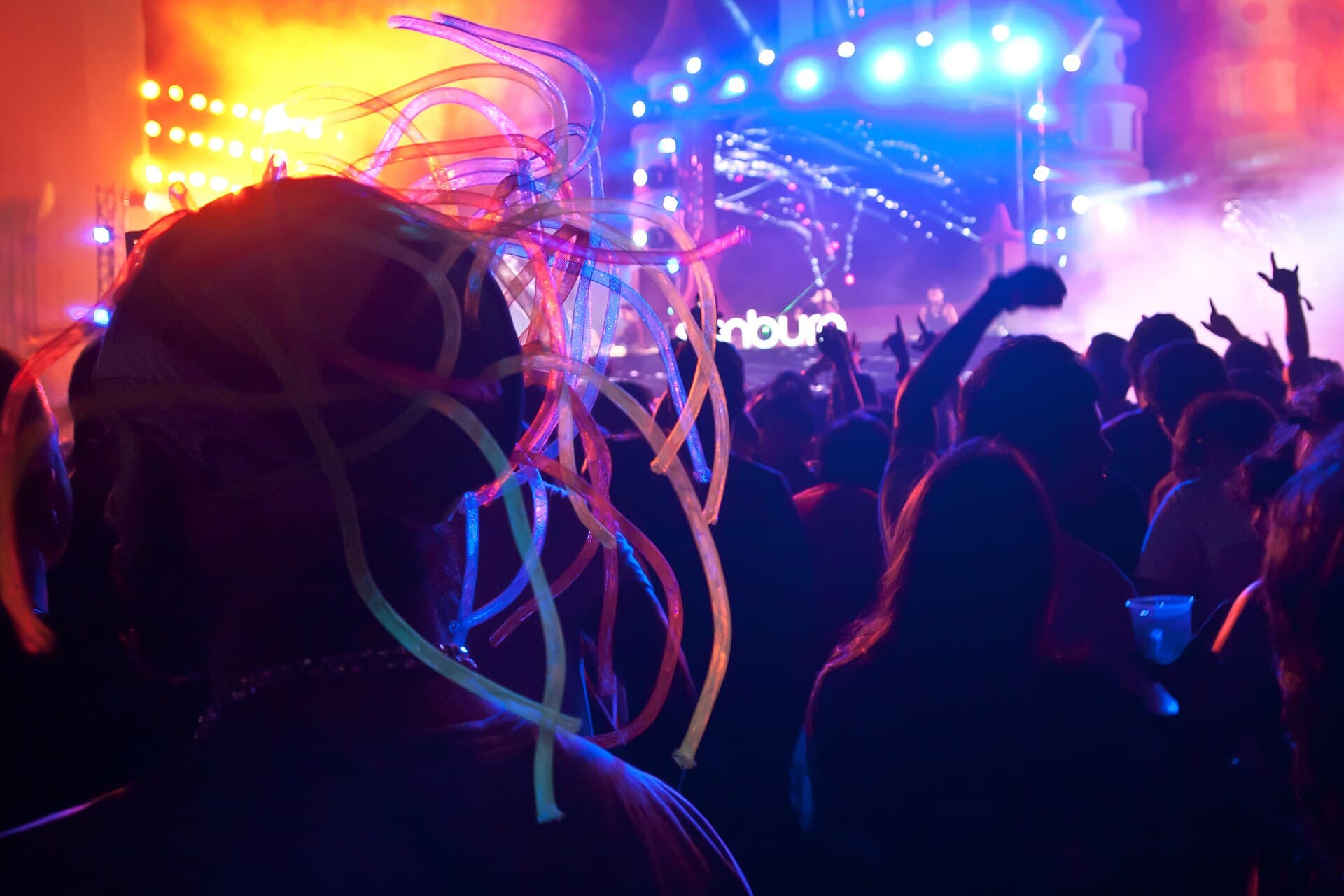 A BookMyShow ticket QR code shown on a phone at a festival gate in Mumbai