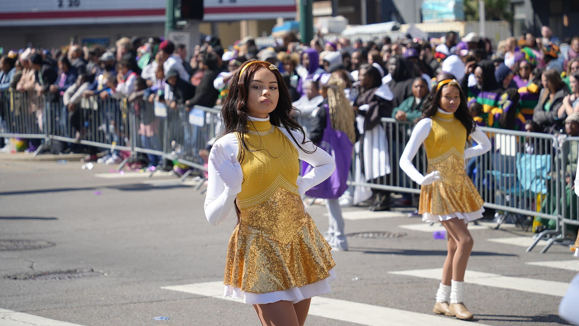 Zulu parade float on Mardi Gras morning in New Orleans with riders in grass skirts handing down painted coconuts