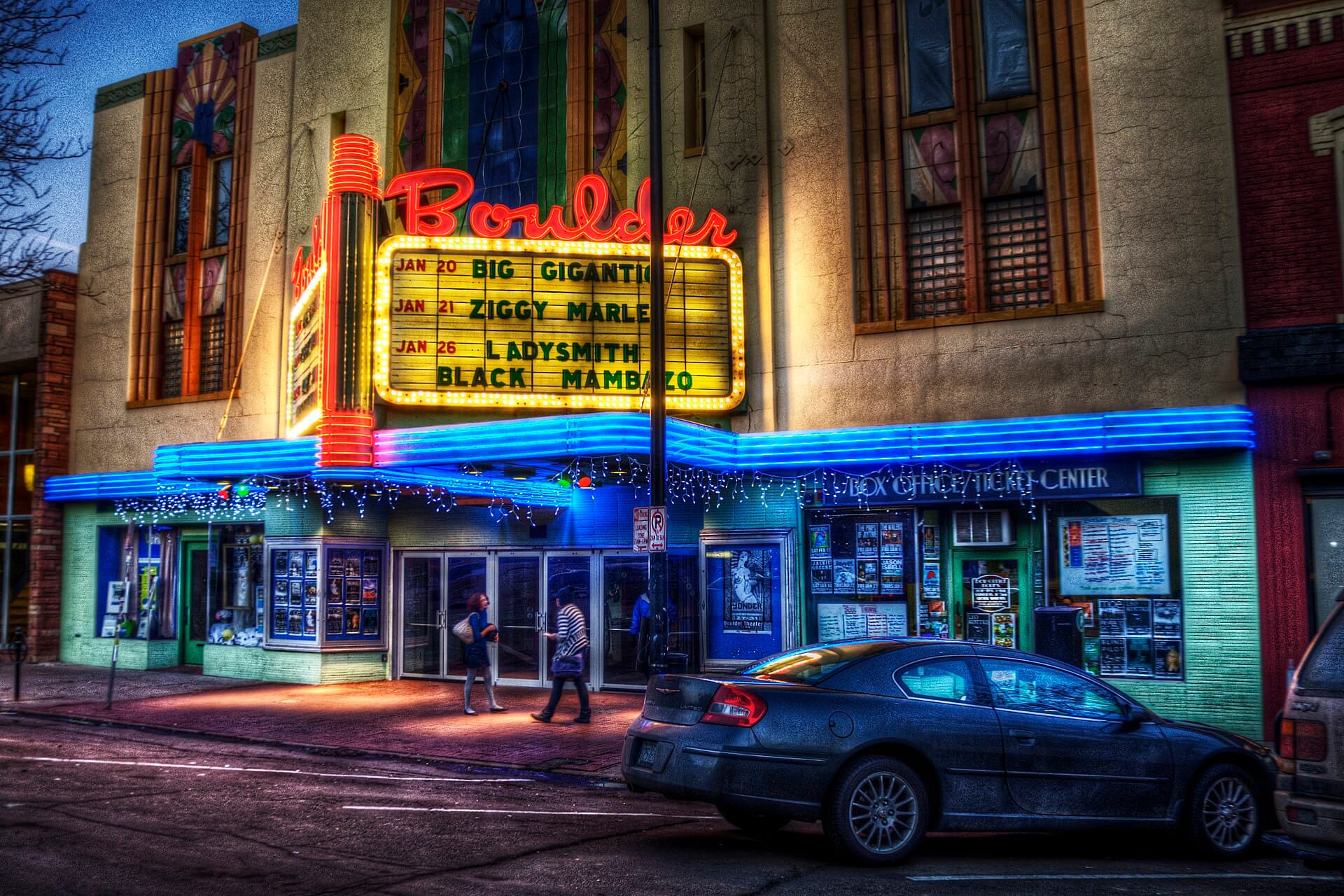 Crowd outside the Boulder Theater marquee on a winter evening