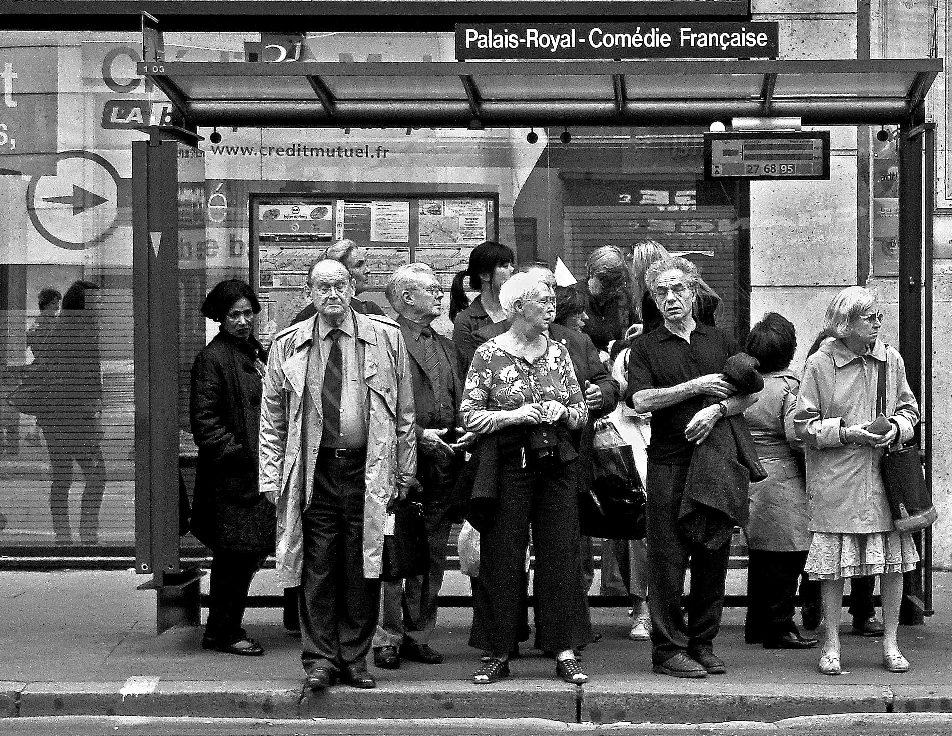 Nice tramway arriving at a stop on Avenue Jean Médecin with passengers boarding