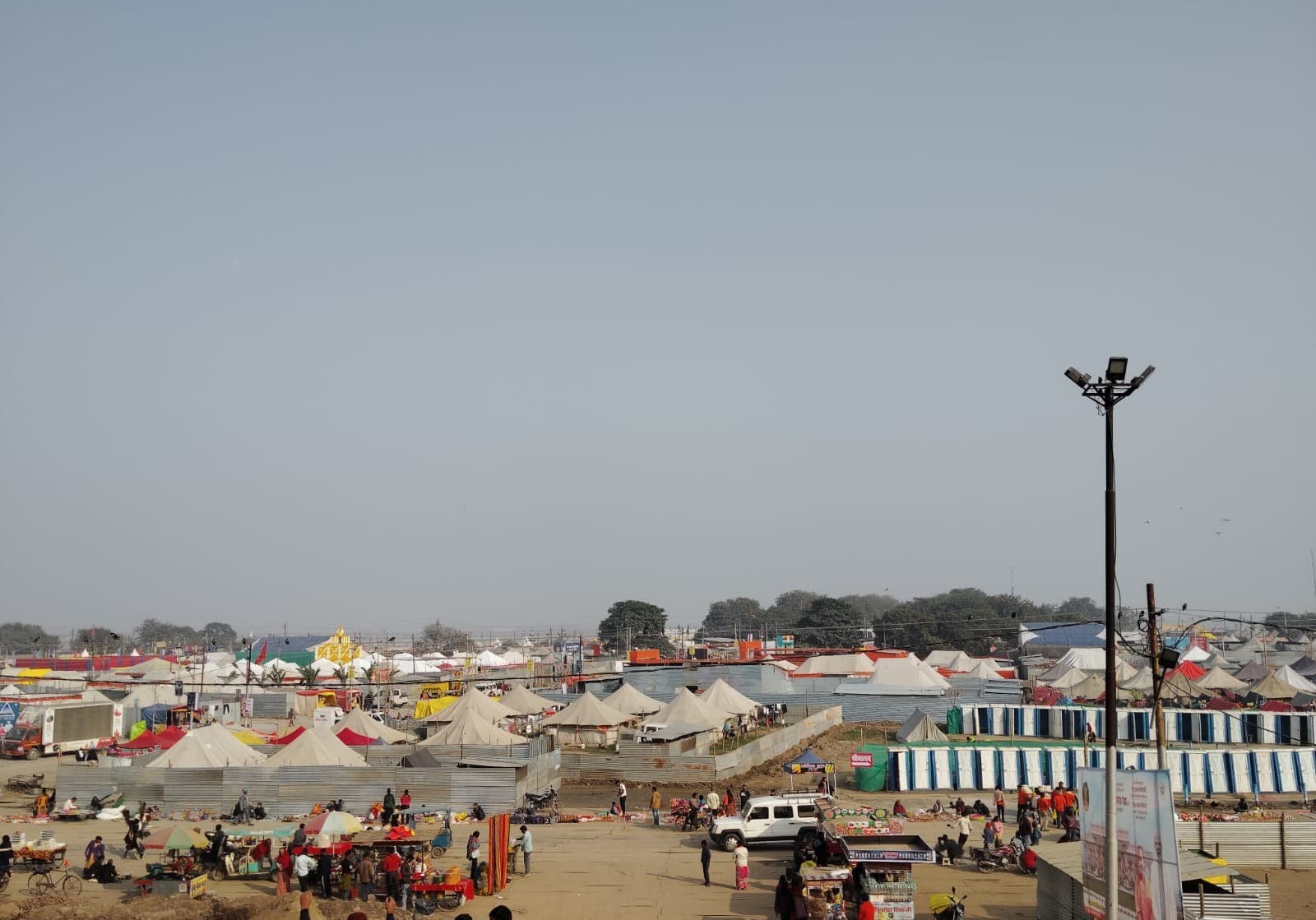 Rows of tents at the Magh Mela tent city on the Arail bank of the Sangam, Prayagraj