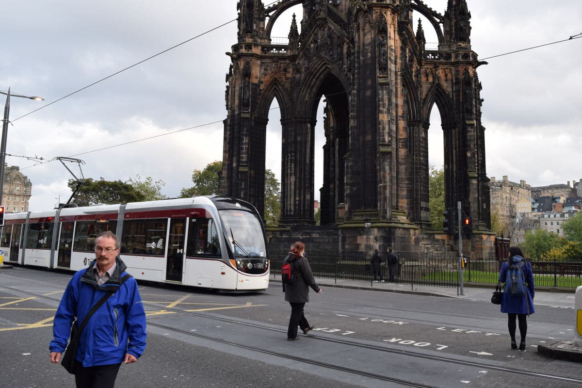 The Scott Monument and Princes Street with a tram passing in winter