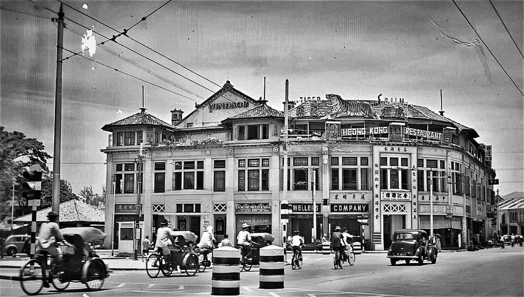 The Capitol Theatre facade at the junction of Stamford Road and North Bridge Road in Singapore lit up at night