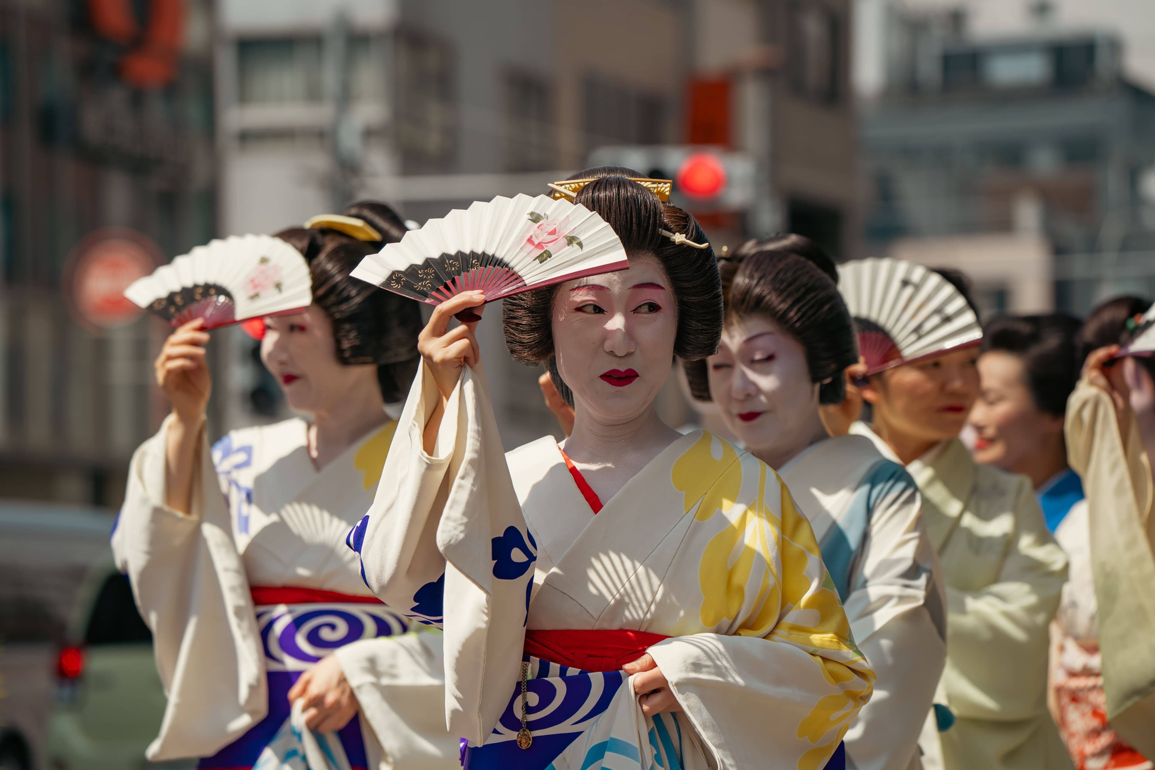 Hundreds of carriers in happi coats crowding the courtyard of Asakusa Shrine at dawn as one of the three great mikoshi is lifted during the Sunday miya-dashi